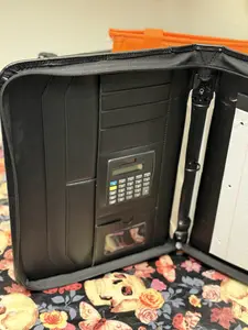 Binder with calculator and pen