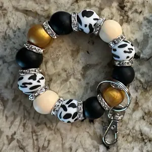 Yellow/gold cow silicone wristlet keychain