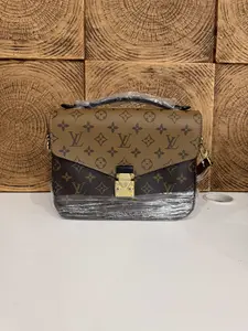 Pre-owned Louis Vuitton Pochette Métis Reverse Monogram Canvas Bag with Gold Tone Lock
