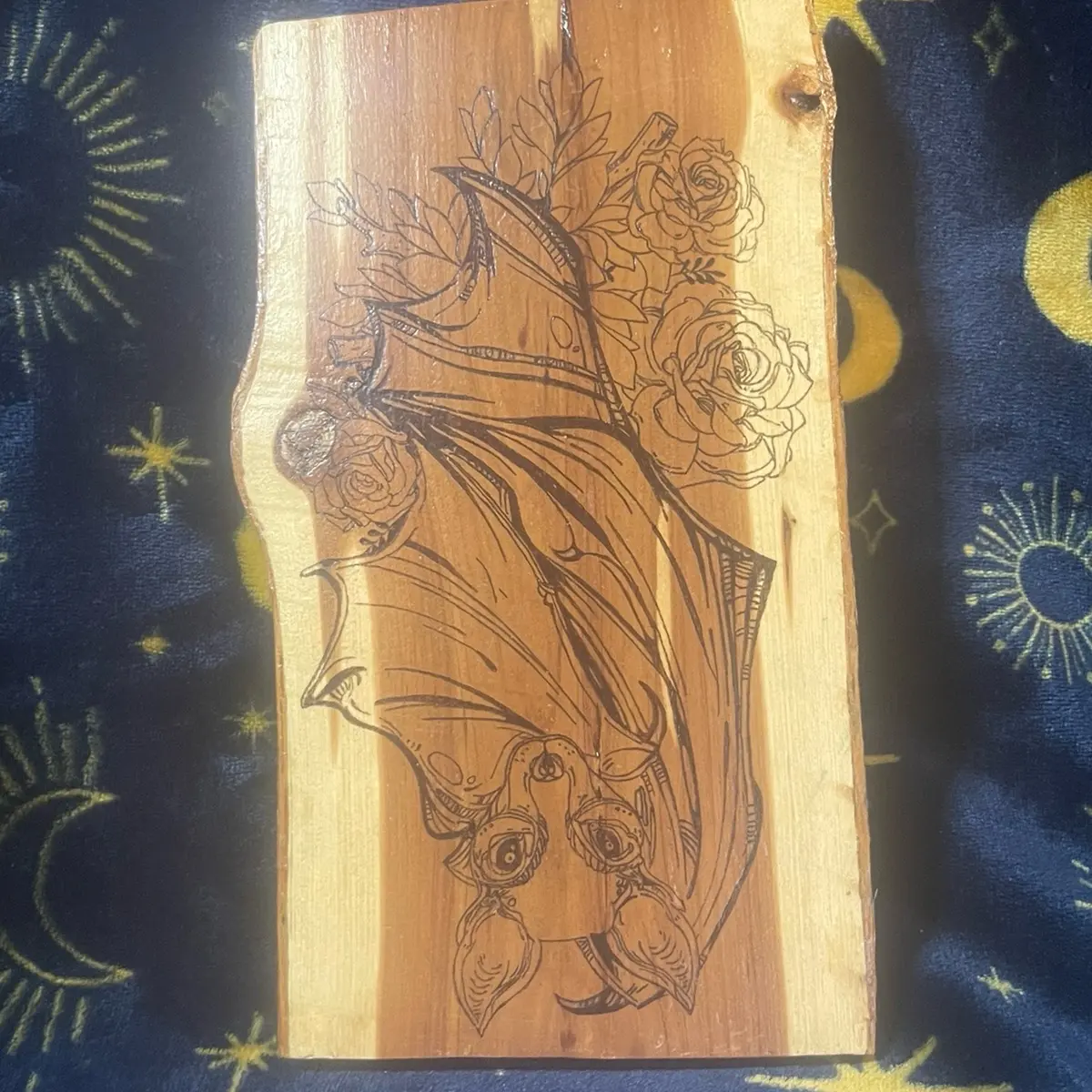 Sweet bat on a rose bush Pyrography