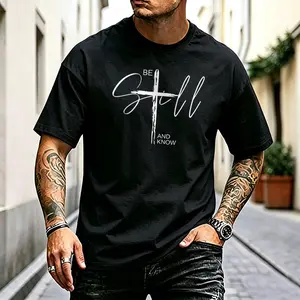 Handwritten floral “BE STILL” design, minimalist lines, cross motif, English text for men’s short sleeves; soothing, calming, gentle short phrases; loose oversized fit; heavyweight crew neck T-shirt; solid color casual menswear.
