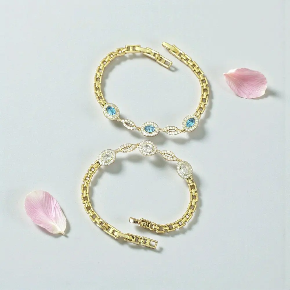 Pulseras elegantes doradas con zc color disponibles azul y clear. Medida 7.5 pulgadas