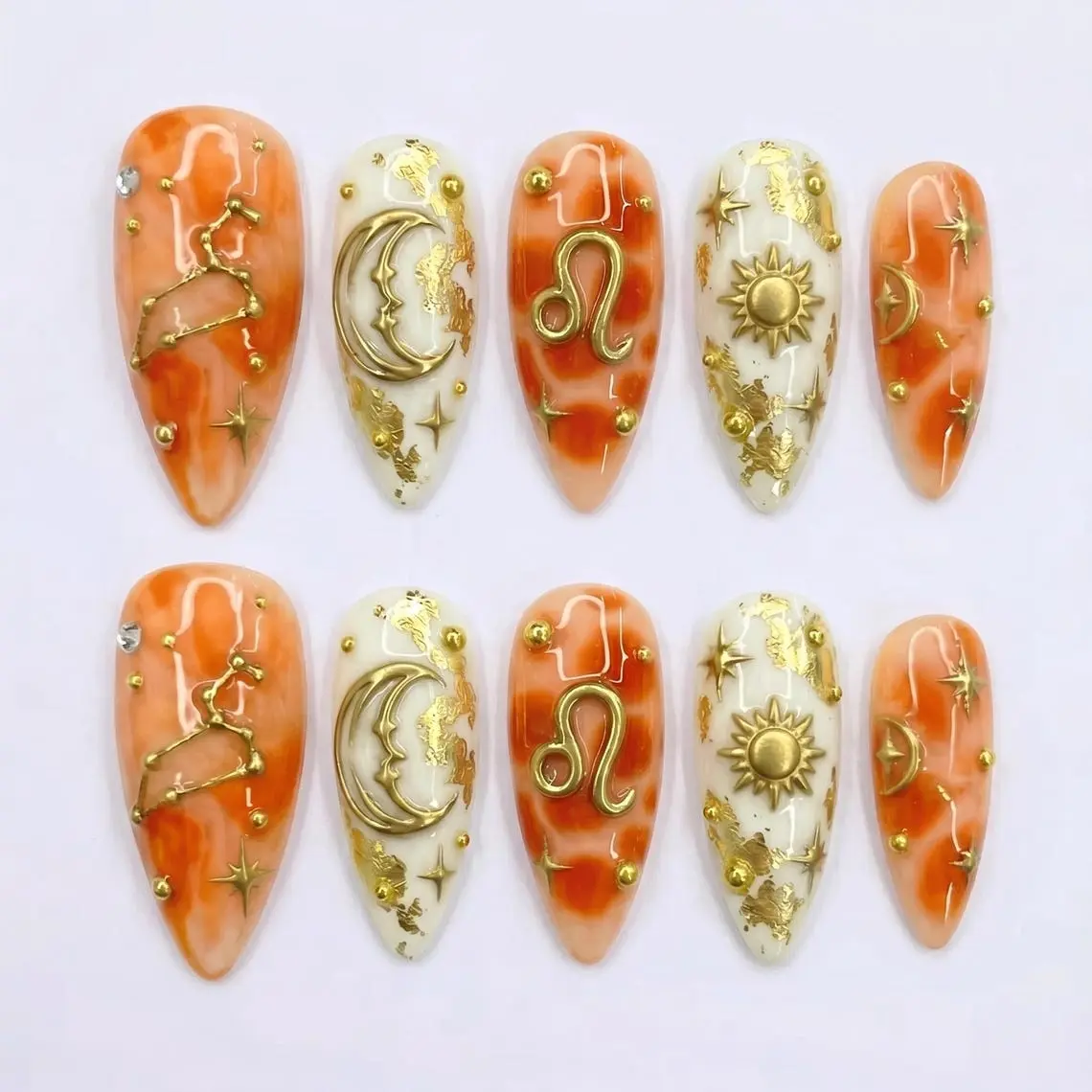 Mismatched 3D Leo Zodiac Press on Nails with Gold Celestial Sun & Moon | Fake Nails in Short Almond | Orange Marble Astrology Art
