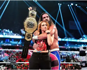 Seth Rollins & Becky Lynch WWE Unsigned 2025 Clash In Paris Raising Title Photograph