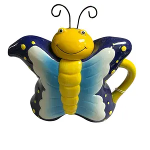 Adorable Butterfly Teapot - Colorful Design with Yellow Body and Blue Wings for Fun Tea Time