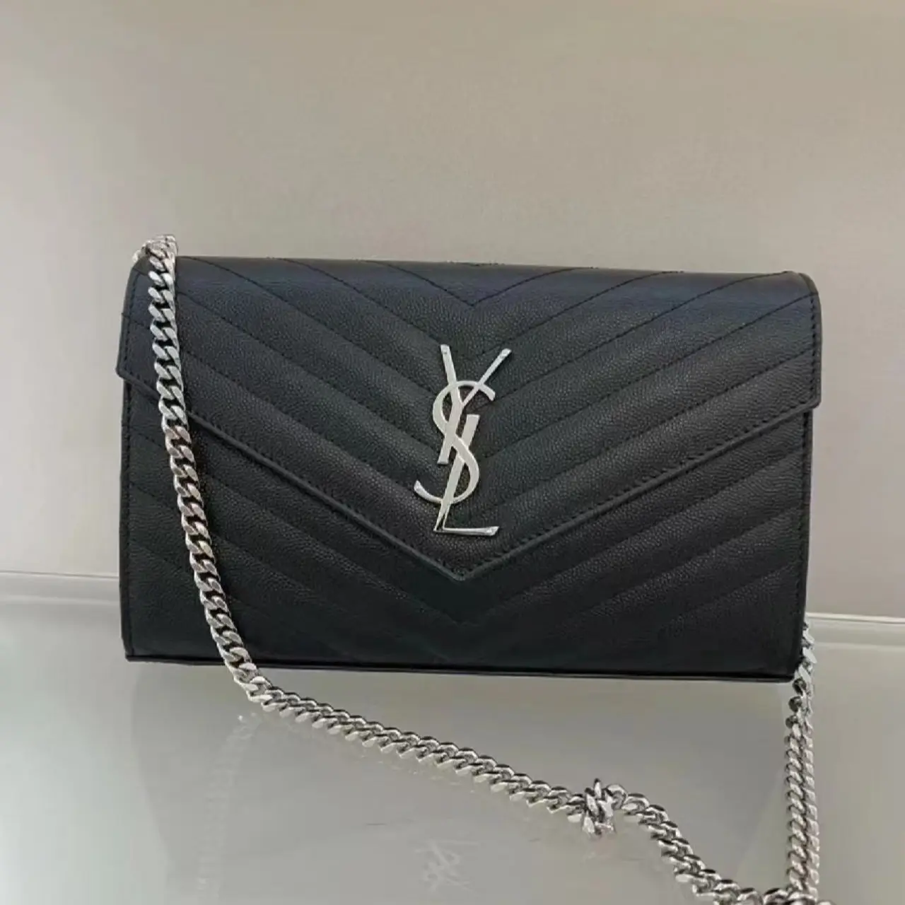Pre-owned Yves Saint Laurent YVESSAINTLAURENT YSL Saint Laurent Cassandre envelope bag in middle black grained leather with a silver chain
