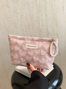 Fashionable, simple and unique personalized handbag, trendy minimalist purse, casual and versatile exquisite large capacity storage bag with heart pattern design, zipper hanging decoration design, suitable for dating, attending dinners, parties