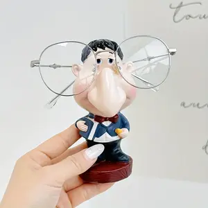 Cute Teacher Eyeglass Frame Base — Featuring vivid expressions and nose bridge design, the stable base is suitable for home, office, and optical shop decoration and display. A perfect humorous and fun gift with a strong sense of art.