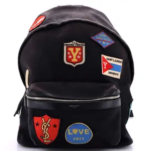 Pre-owned Yves Saint Laurent Canvas Plain Backpacks Saint Laurent City Backpack Patch Embellished Canvas Medium by Rebag