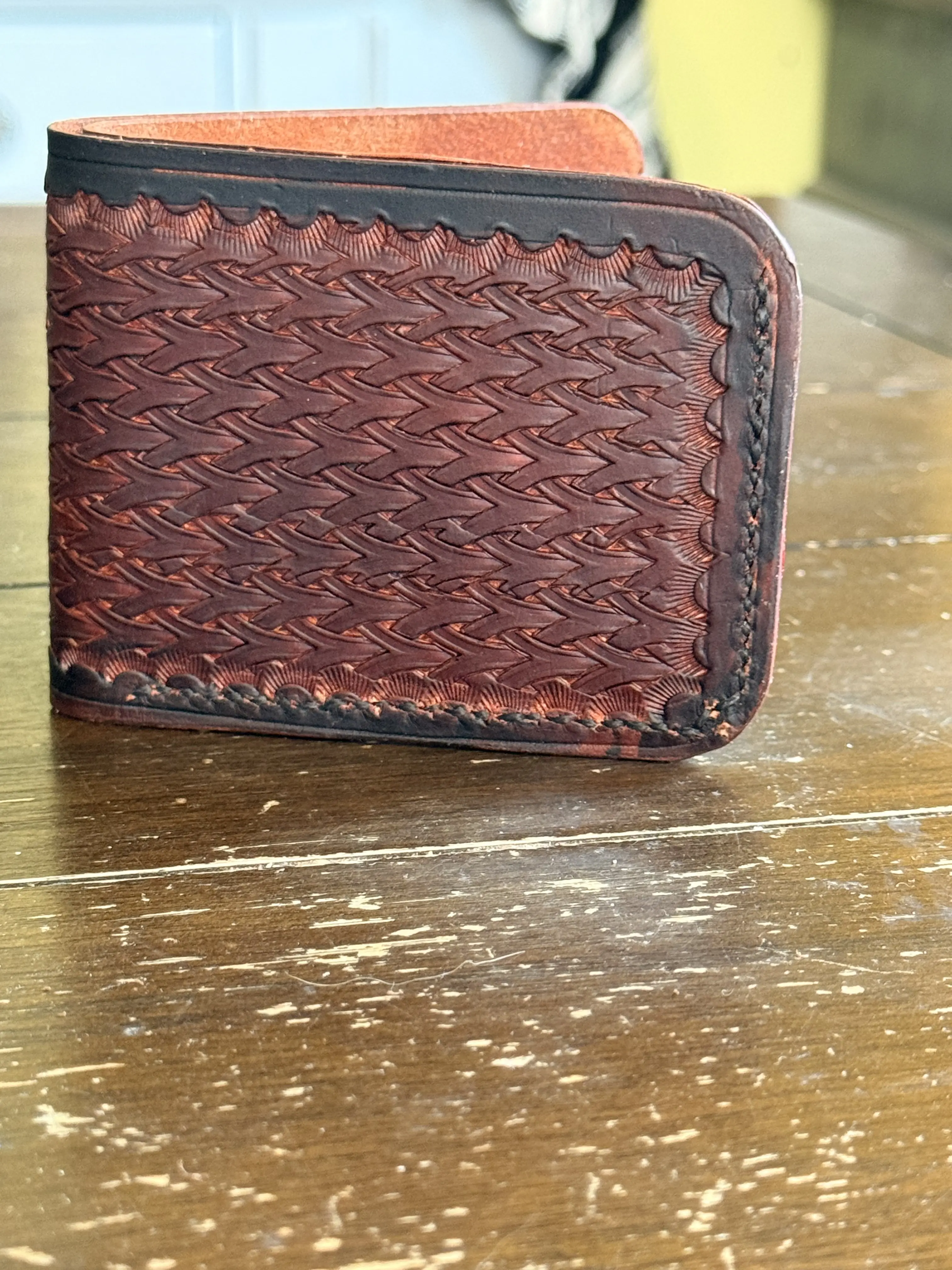 Hand made leather bi-fold wallet with hand tooled outside pattern