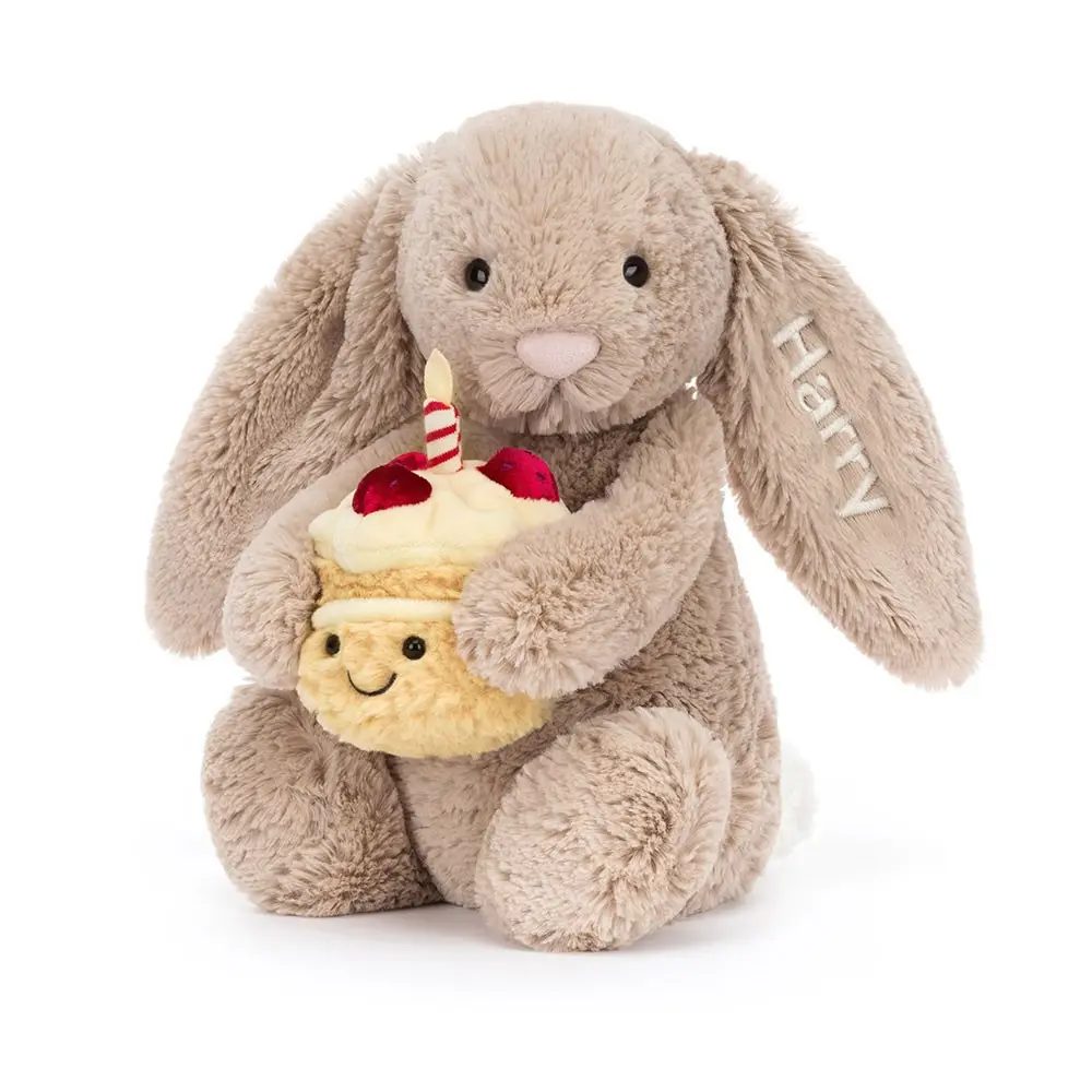 Jellycat plush bunny hugging a birthday cake, so cute.