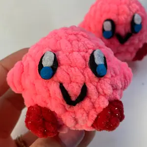 Pink Crochet Kirbs made with plush yarn! Stuffed with polyester fiberfil to make it squishy!