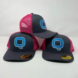 Q Snapback Cap. Color pink and grey with the Q embroidery. Mech back