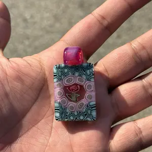 Beautiful milli pendant featuring a Rose milli in the center made by jeffheathbar