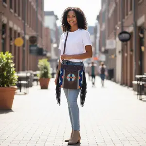 Crossbody Bag with Hand Tooled Patch and Fringes. 5399