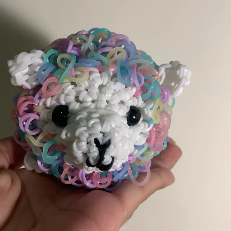 Crochet fruity pebble llama made with rubber bands