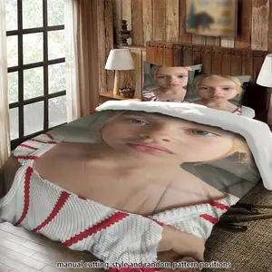 A blonde girl wearing a red and white striped top in a three-piece bedding set, suitable as a gift.