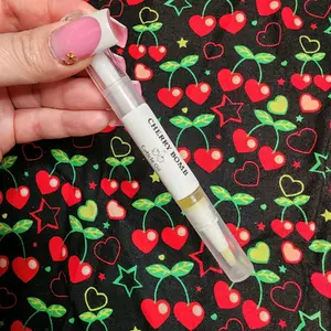 Cherry Bomb Cuticle Oil Pen - Original Organic Formula in Clear Bottle with cherry accents