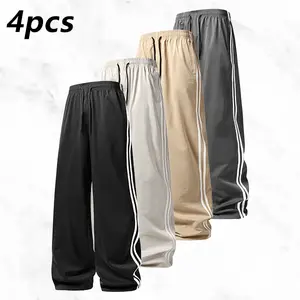 Trendy versatile wide-leg pants with side stripes, the side stripe details add visual depth, while the draped fabric enhances the overall flowiness. Available in multiple colors to pair with various tops, perfect for shopping at boutiques or after-work ga