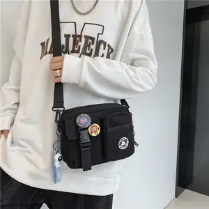 Unisex Casual Plain Color Release Buckle Crossbody Bag with Astronaut Charm, Fashionable Versatile Zipper Crossbody Bag with Random Color Badge, Trendy Shoulder Bag for Daily Use