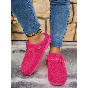 Women’s simple, stylish indoor home slippers featuring a comfortable, warm soft sole with thick cushioning and an anti-slip design—ideal for cozy home wear.