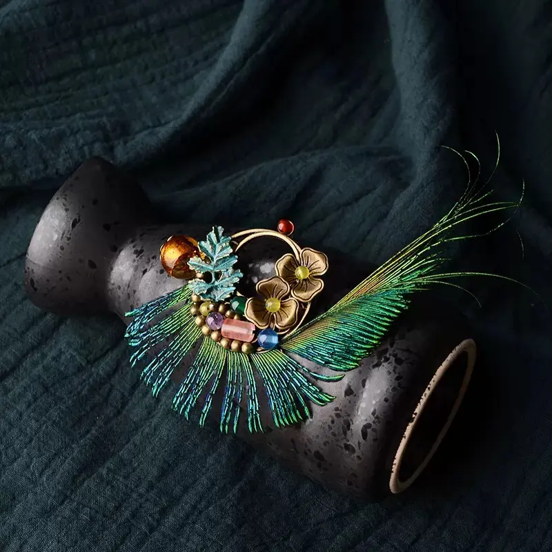 Feather charm