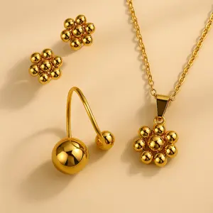 Conjunto Flor Dorada | Acero Inoxidable Chapado en Oro 18K