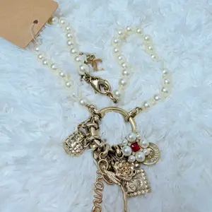 Pre-owned Cream-colored faux pearl fine chain (the warm luster unique to vintage pieces with slight oxidized aging) Bag Accessories Chanel, Vintage Pearl Multi Pendant Long Necklace