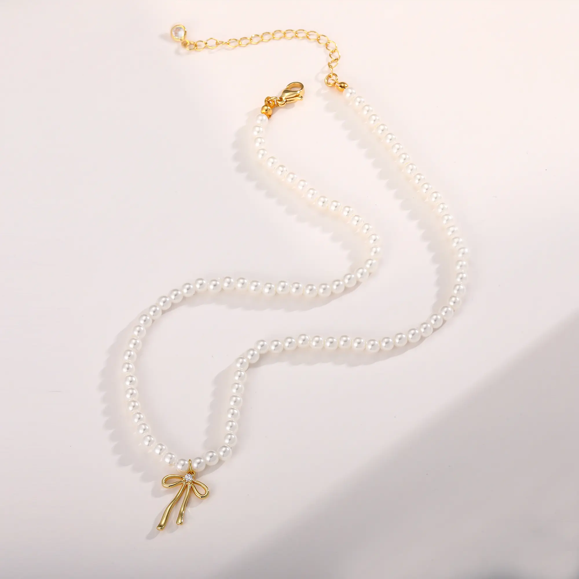 Pearl Chain Bow Pendant