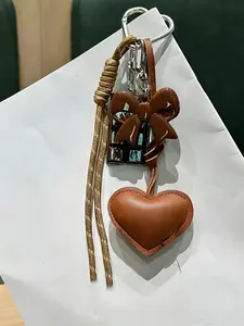 Butterfly Knot Leather Heart Bag Charm, Braided Rope Keychain, Backpack Accessory, Stylish Gift, All Seasons, Casual Style, Backpack Bag Charms