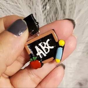 Amora's Dust Plug Charm called "Teacher A,B,C's". Available in Type-C and Iphone, material acrylic for cellphones, tablets  etc...