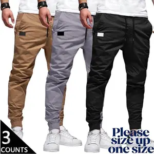 Men's 3-Pack Casual Jogger Pants - Khaki, Grey & Black Colors - Elastic Waist with Drawstring, Ribbed Cuffs, PU Patch Detail - Lightweight 100% Polyester Fabric - Perfect for Streetwear, Travel, Daily Wear - S-3XL Sizes We recommend buying one size up.