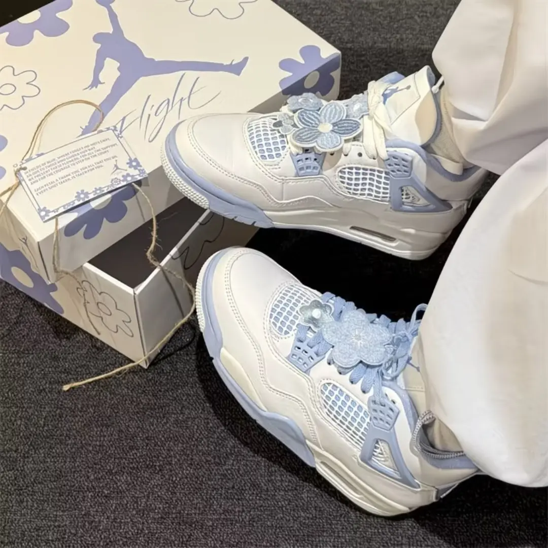 White‑light blue mid‑top basketball sneakers, smooth leather upper, 3D floral ornaments, mesh panels, cushioned midsole for unisex street casual outfits