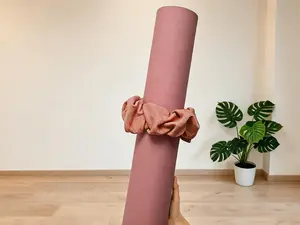 Pilates mat scrunchieYoga Mat Scrunchie, made of stretchy durable fabric to securely hold your yoga mat. Stylish and portable, fits all standard size yoga mats (mat not included).