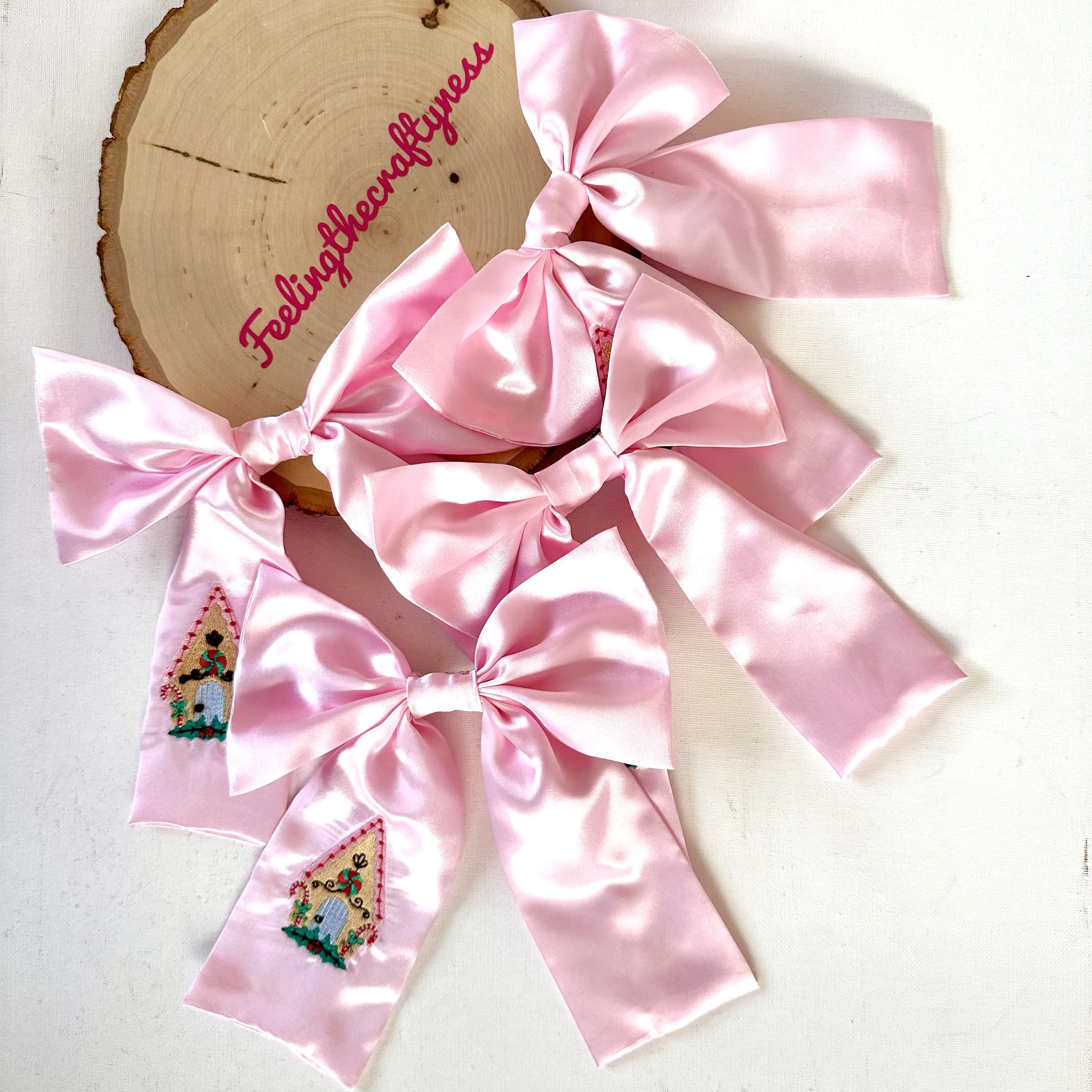 Christmas Gingerbread House Hair Bow - Pink Satin Bow with Embroidered Gingerbread House in Santa Hat for Festive Hair Accessories