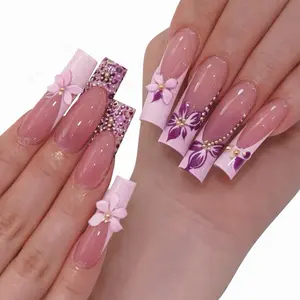 Elegant Pink and Purple Floral Nail Art with Rhinestones and Gold Accents for a Chic Look