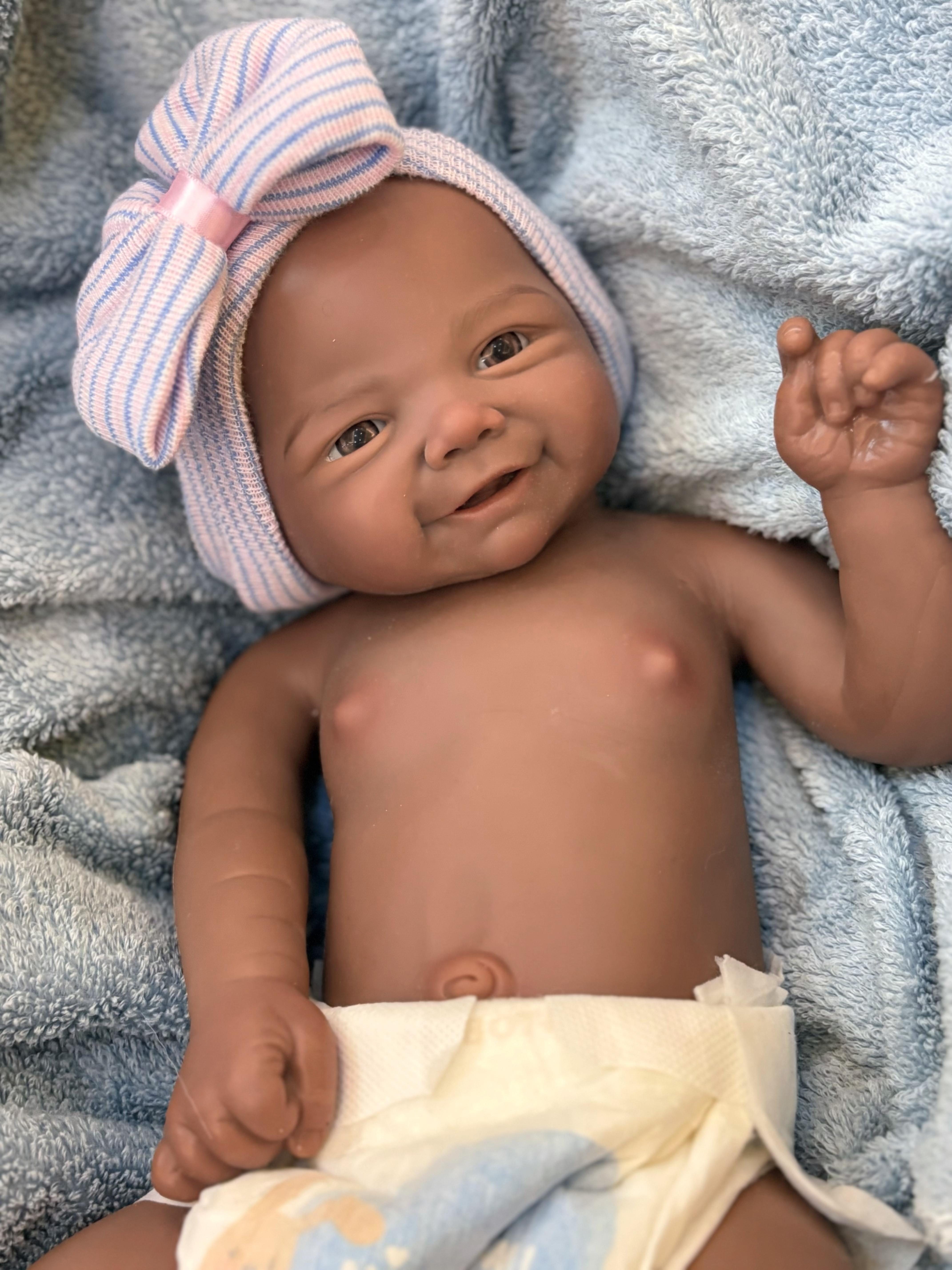 Reborn Doll Soft Silicone 18 inches Lifelike with Happy Smile Brown Skin Soft Body Realistic Details Includes Comfort Item Bottle Birth Certificate Perfect for Birthday Gifts Collectors and Children