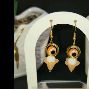 Hand Beaded Hanging Orange Evil Eye Crafted Hook Earrings with Gold Accents and Unique Design