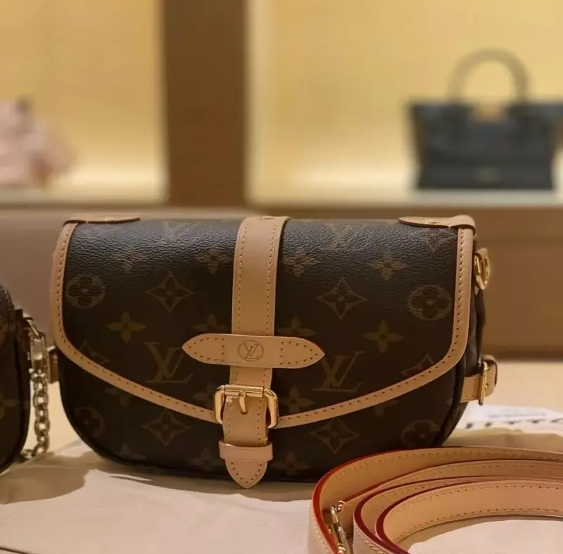 oL  ‬Saumur BB Classic Monogram Saddle Bag With Adjustable Leather Strap