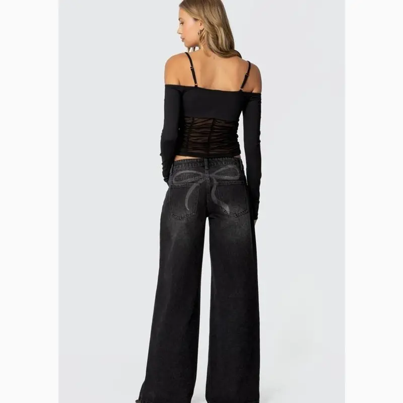 EDIKTED Vyxen Vintage Washed Low Rise Baggy Jeans - 100% Cotton Rigid Denim with Back Bow Graphic & Machine Washable