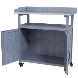 Gray painted wooden outdoor potting bench with wear resistant aluminum tabletop rolling rubber wheels and double door cabinet serves mobile gardening work for backyard patio balcony spaces