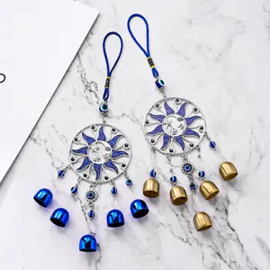 Wind Chime with Blue "Evil Eye" — Hanging Bell Ornament featuring Stars, Moons, and the Evil Eye Motif