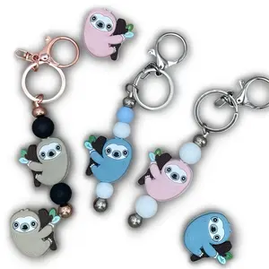 Oh so cute sloth keychain! Trending accessory, silicone sloth focal bead. Purse charm, Christmas stocking stuffer, birthday gift.