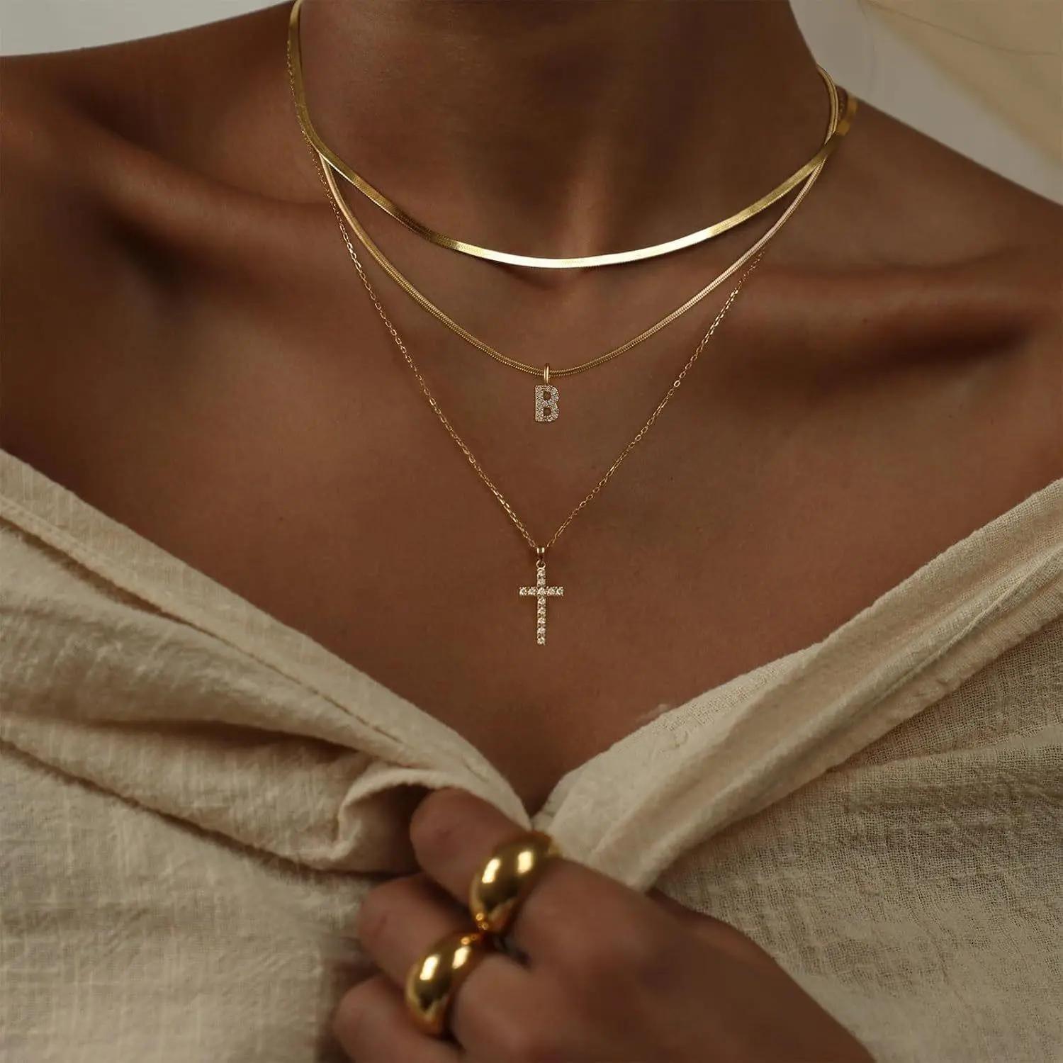 DUOREM  Layered Gold Necklaces for Women Tiny Initial Necklaces 14K Gold Plated Stackable Necklaces with CZ Cross Design Safety Pin Necklace Chains