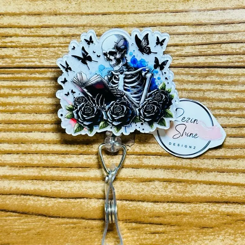Skeleton With Book Badge Reel
