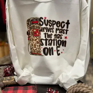 Suspect drives past the gas station on E sweatshirt