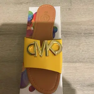 Women's Footwear - Yellow and Brown Color Block Design with Gold Logo Detailing