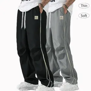 2-pack — Men’s black sweatpants featuring white side stripes and embroidery; casual athletic loose-fit joggers; trendy street-style pants with a drawstring waist and straight-leg cut; polyester fabric — men’s pants