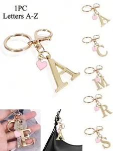 1pc Premium Elegant Gold Letter Keychain, A-Z Alphabet 3D Pendant With Pink Heart Charm, Fashion Alloy Keyring, Backpack Hanging Decor/Car Key Chain, Perfect Women's Daily Accessory, Couple Gift, Classic Minimalist Keychain, Decoration, Bag Charm