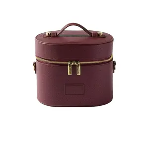 ETOILE COLLECTIVE Oval Toiletry Case in Burgundy